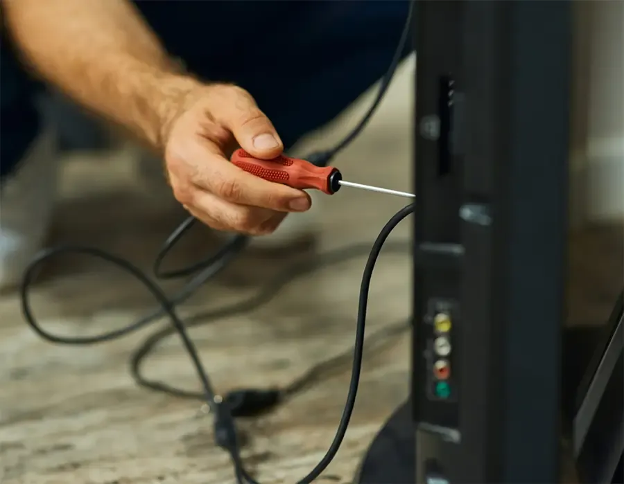TV repair technician at work
